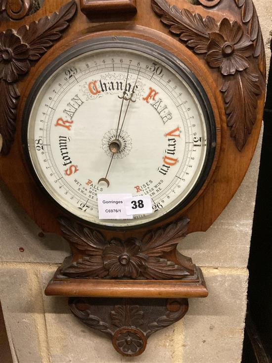 An Edwardian walnut aneroid wheel barometer / thermometer, height 98cm